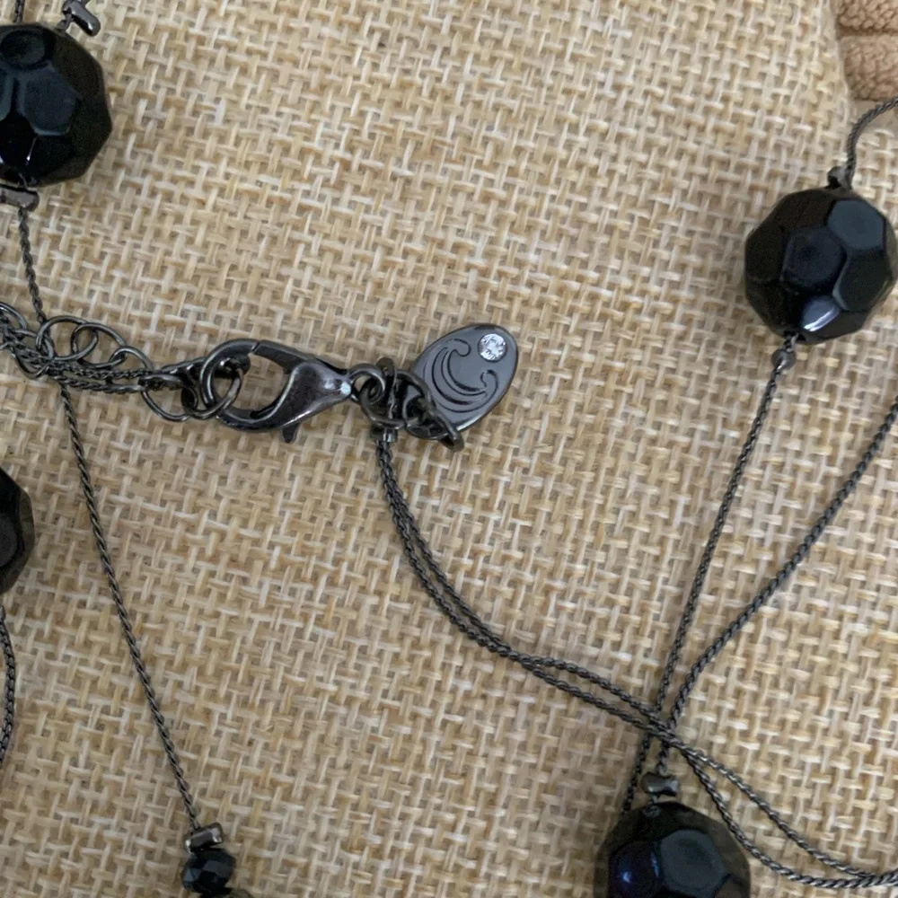 Long elegant black necklace with net over glass beads